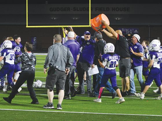 Head coach Mark Hice and players celebrate Gilmer’s championship.