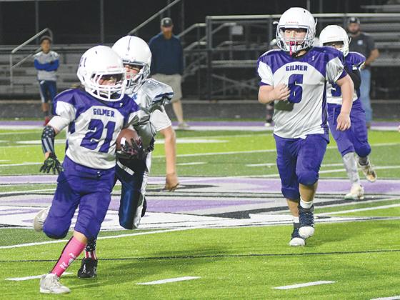 Gilmer sixth-grade cornerback Jackson Jones returns one of his two interceptions versus White County last Saturday.