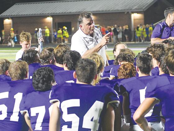 Gilmer High head coach Paul Standard addresses the Bobcats following a game earlier this season. GHS will take the field for its regular-season finale Friday versus White County.