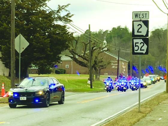 The procession carrying late Speaker of the Georgia House of Representatives and Gilmer County native David Ralston departs from Logan Funeral Home Tuesday, Nov. 22, en route to the Georgia Capitol in Atlanta, where he was to lie in state. Ralston, who passed away Nov. 16, represented House District 7 (Gilmer, Fannin and part of Dawson County) for almost two decades and led the Georgia House as its speaker since 2010. He was laid to rest Sunday following a public funeral service in Blue Ridge. (ETC Photo)