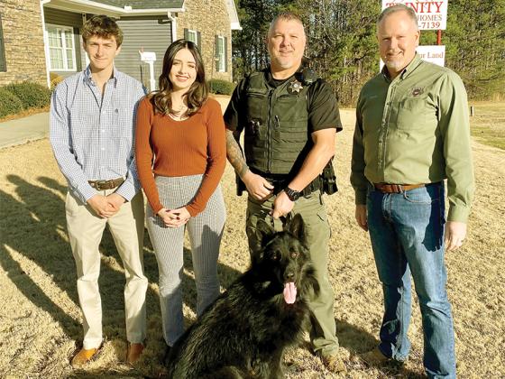 Zach and Hope Bobak (of Trinity Custom Homes), Patterson, Arlo and Sheriff Stacy Nicholson.