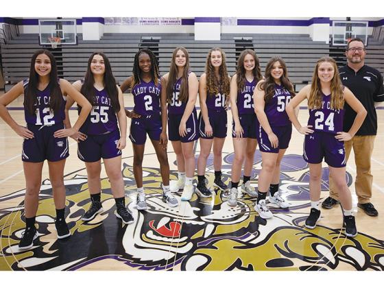 Above with Clear Creek basketball coach Les McDaniel are eighth-grade basketball players. From left are, Morgan Palmeri, Madison Hall, Kiana Jones, Marley Hopkins, Jaylee McDaniel, Kenley Thompson, Emma Kate Bramlett and Sarah Dale. (Photo Courtesy of 247 Frames)