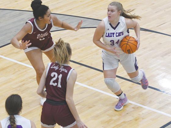 Gilmer Lady Cat Lucy Ray drives into the lane before taking a jump shot against Dawson County last Friday.