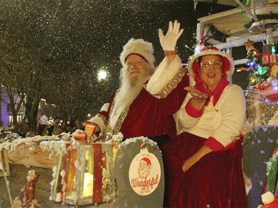 Mr. and Mrs. Semper-Fi Santa wave from their sleigh