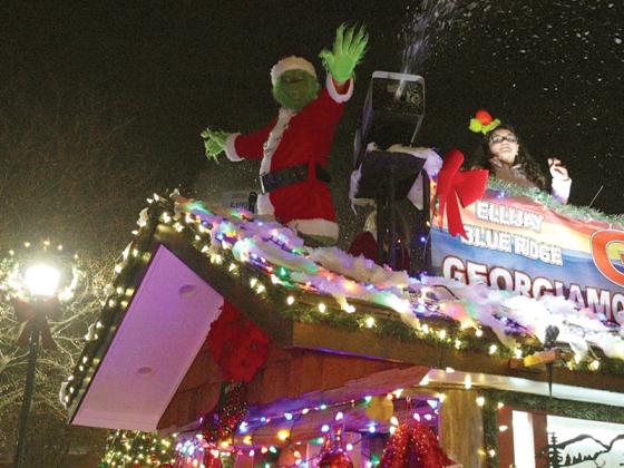 The Grinch sprayed snow on the parade watchers