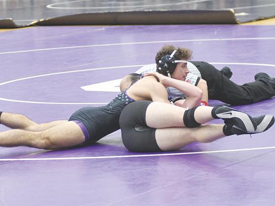 Gilmer High School senior Hunter Brown works on securing a pin versus his Forsyth Central opponent at last Friday’s Bobcat Duals.