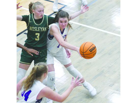 Gilmer High’s Marley Boatwright passes to Lucy Ray versus Wesleyan last Tuesday.