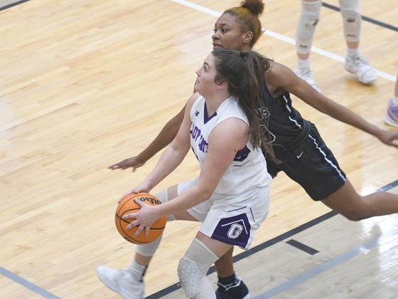 Gilmer High’s Anna Waddell drives to the basket versus West Hall last Tuesday. She was one of three Lady Cat seniors recognized following the game.