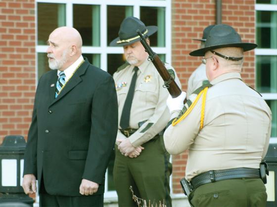 Gilmer Sheriff’s Office chaplain, the Rev. Scotty Davis, speaks to those gathered in front of the courthouse before leading a prayer. “Brett Dickey is a man who is honored in so many ways. This morning, you have honored him by coming out and taking these moments,” he said.