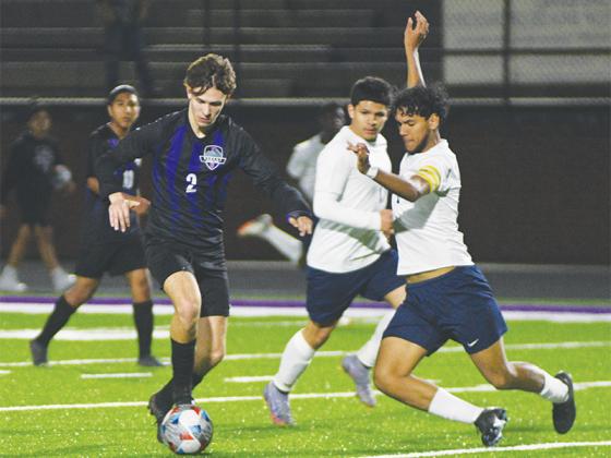 Bobcat junior Connor Seim (2) prepares to dodge a slide tackle versus West Hall last Friday.