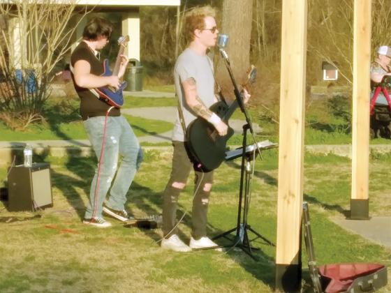 Adrian Stover, right, and CC Loud, left, entertain eventgoers with a mix of rock hits.
