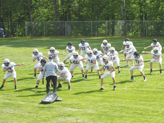Gilmer High School started spring football practice Monday and eighty-two players were in attendance. Much of the first day was spent focusing on the basics such as agility and proper technique and footwork.