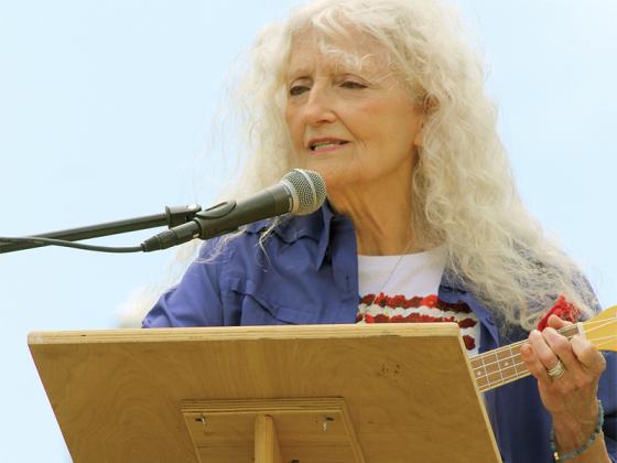 Lucy Harris, the Gold Star mother of First Lt. Noah Harris who was killed in action in Iraq, sings a poem he composed and that she set to music. The rendering was a special tribute to her son and all veterans who were remembered on Memorial Day.