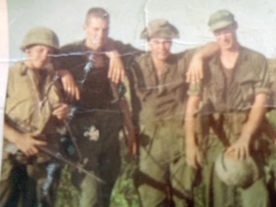 Some of Gilmer County native Thurlo McClure’s squad members in Vietnam were, from left, Roger Vonholdt (had both legs blown off in an artillery barrage), John Beck (recently passed away from Agent Orange-related cancer, according to Cpl. John Verton), John Prostio (shot in the hip and med-evacked, never to return) and McClure (holding helmet, killed in action not long after the photo was taken).