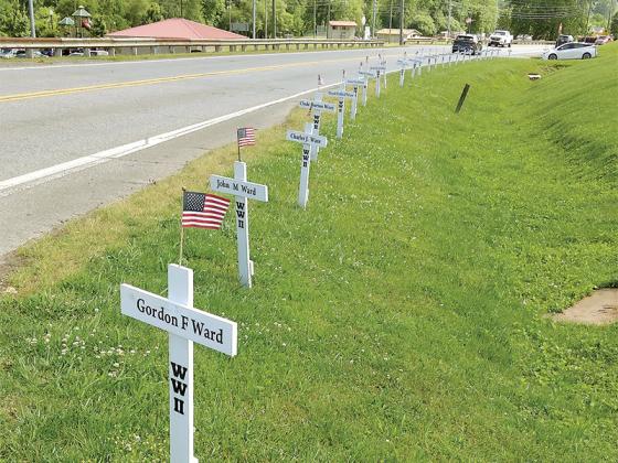 Crosses commemorating deceased Gilmer County veterans line South Main Street.