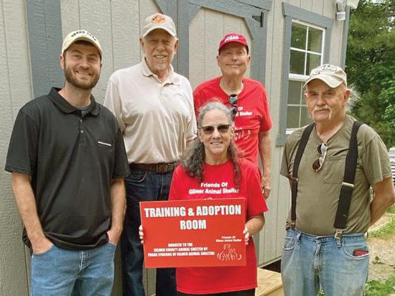 Gilmer Animal Shelter Director Daniel Laukka, left, is pictured with Friends of the Gilmer Animal Shelter (FOGAS) members Bill Schmid, Sylvia Harris, Jack Peaden and Bob Dolloff in front of the animal shelter’s new training and adoption building, also seen below.