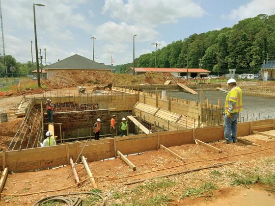 As construction of the new Gilmer County Swimming Pool continues, crews work to complete wiring and pipe installation on the site’s deep well, at left. At right, is the lap pool, which will be the site’s biggest swimming area. 