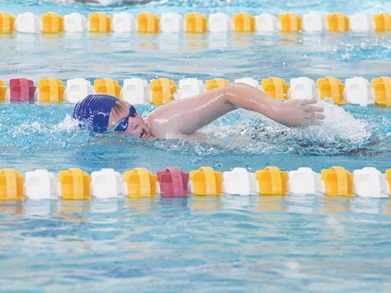 Reece Smith (above) and Lilly Jones (below) helped the Gilmer County Swim Team earn 17 first-place finishes at last Saturday’s district championships.
