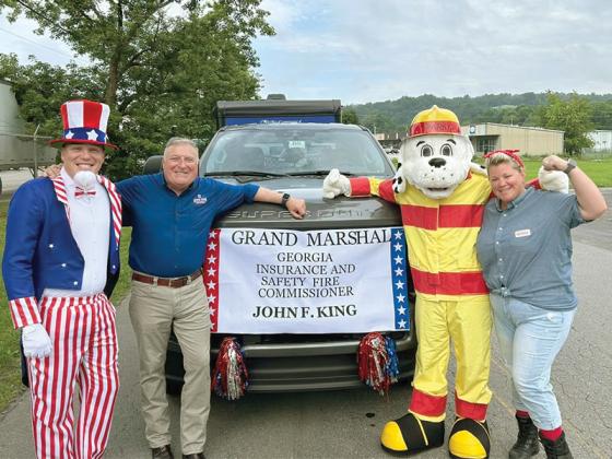 Parade Grand Marshall John King lines up with other parade participants. (Photo by Robert Ferguson)