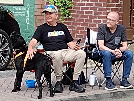"Blackie" (not his real name) was howling as the fire engines let loose with sirens during the Fourth of July parade Tuesday morning. (Photo by Mark Millican)
