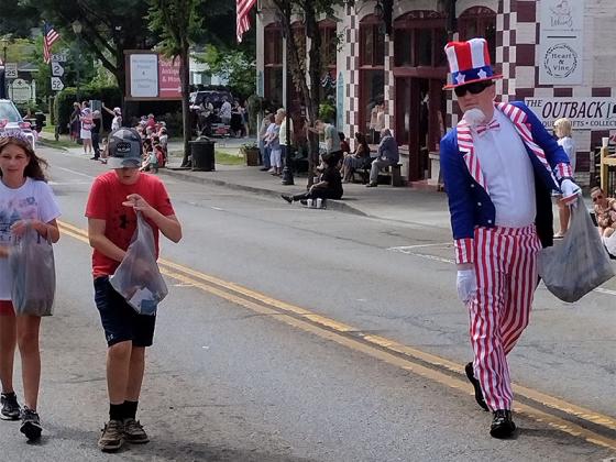 Uncle Sam gets some help dispensing treats during the Fourth of July processional in downtown Ellijay. (Photos by Mark Millican)