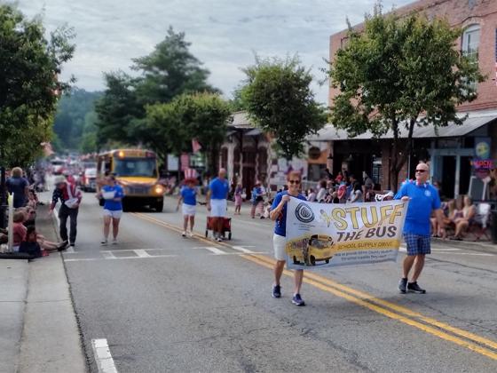 The Gilmer County Optimist Club promoted their "Stuff the Bus" campaign during the July 4 parade to help kids get school supplies. (Photo by Mark Millican)