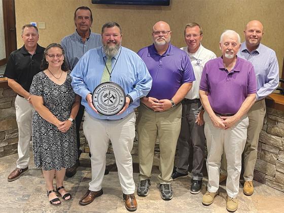 Gilmer College and Career Academy CEO Carla Foley and teacher Kris Martinez were presented with a medallion last Monday from the Law and Public Safety Education Network recognizing their newly certified public safety program. They are joined from left by, Gilmer County Board of Education member Joe Pflueger, vice chairman Michael Parks, superintendent Dr. Brian Ridley, chairman Doug Pritchett and members Michael Bramlett and Jacob Callihan.