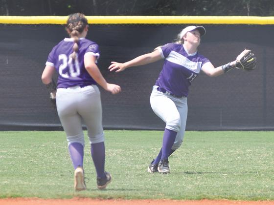 Gilmer High School senior right fielder KateLynn Carder (13) chases down a fly ball for an out.