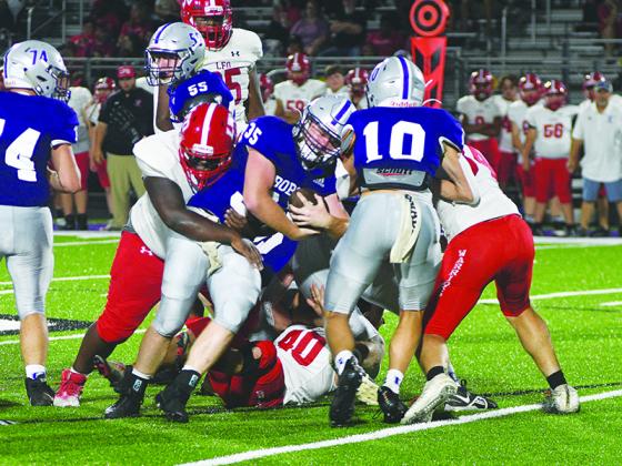 Gilmer junior fullback Wyatt Stokes (35) keeps a drive alive in the third quarter of last Friday’s game versus Lakeview-Fort Oglethorpe. He finished the game with 83 yards and a touchdown on 13 carries.