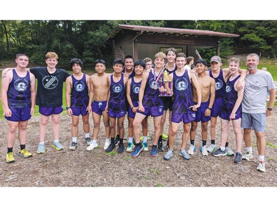 The Gilmer High School Bobcats strike a pose with their runner-up trophy from last Thursday’s 5K race in Blairsville.