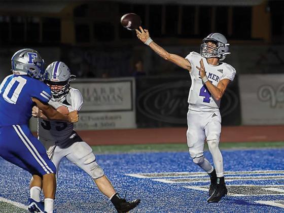 Gilmer High junior quarterback Issac Rellinger throws out of his own end zone versus Fannin County last Friday.