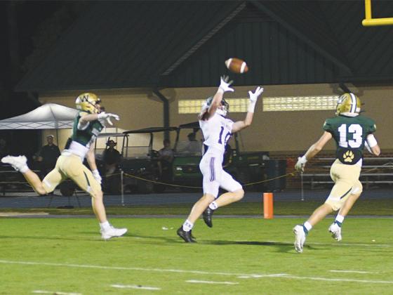 Gilmer High junior halfback Grant Ballew catches a 36-yard pass from quarterback Issac Rellinger for his second receiving touchdown versus Wesleyan last Friday. He also rushed for a touchdown in the fourth quarter.