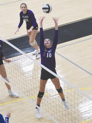 Gilmer’s Madison Bradshaw (10) sets as Lady Cat teammate Anneliese Vaughan (22) gets in position to hit.