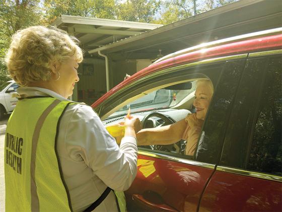 Gilmer Health Department nurse Leigh Ann Dover prepares to vaccinate a patient during last year’s drive-thru flu shot clinic at the ETC Pavilion. This year’s clinic, at the same location, will last from 8 a.m.-5 p.m. (Contributed photo)