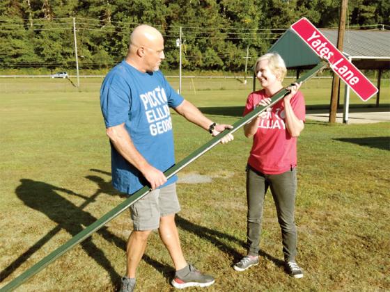 Georgia Apple Festival team members Tod Page and Natalie Knight start plotting where to put the “street signs” for the upcoming 52nd annual festival at the Lions Club Fairgrounds. 