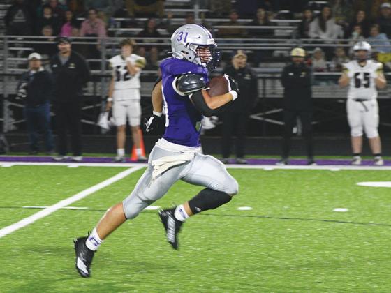 Gilmer senior fullback Aspen Hataway breaks free for a 71-yard touchdown run in the fourth quarter versus Dawson County last Friday to give the Bobcats a permanent lead.