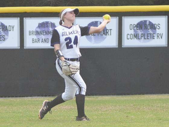 Gilmer High freshman left fielder Sarah Dale relays the ball to the infield, and she had two hits in each of the Lady Cats’ games last week.
