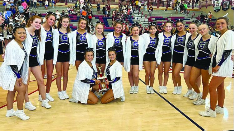 Above are Gilmer High’s competition cheerleaders following their first event of the season last Saturday at Heritage High School. Gilmer scored a 54 to finish third out of five teams in their division. They will return to the mat Saturday at Creekview.