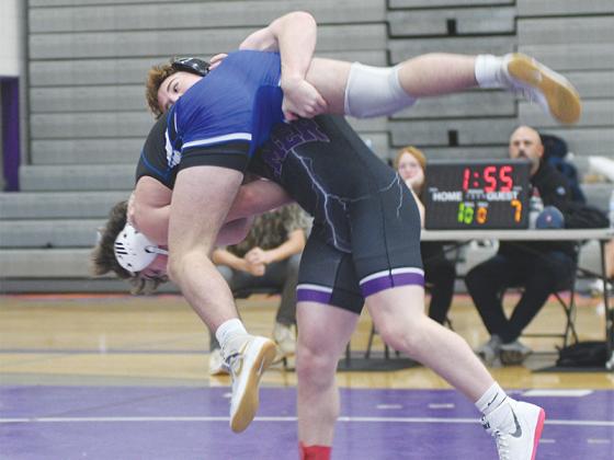 Gilmer senior Bregan Berry sends his Fannin County opponent to the mat at last Saturday’s Bobcat Duals.