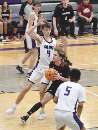 Gilmer High School’s Kohan Davis (4), Ryder Wofford (background) and Jacob Becerra (5) all return for their senior basketball seasons.