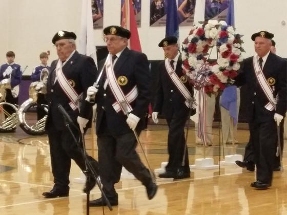 Members of the Knights of Columbus place a red, white and blue wreath in recognition of the veterans who are no longer with us.