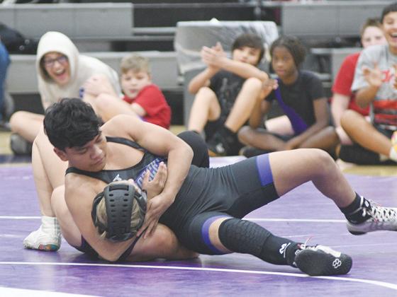 Clear Creek’s Daniel Escobar secures a pin.