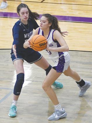 Gilmer High sophomore Chelsey Griggs passes to a teammate after grabbing one of 13 rebounds versus White County last Friday.