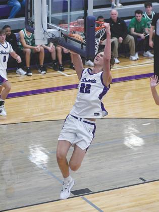 Gilmer High School junior Jackson McVey finishes his drive to the basket with a dunk versus Pickens last Tuesday. He scored 31 points and grabbed 20 rebounds in Gilmer’s 76-71 win.
