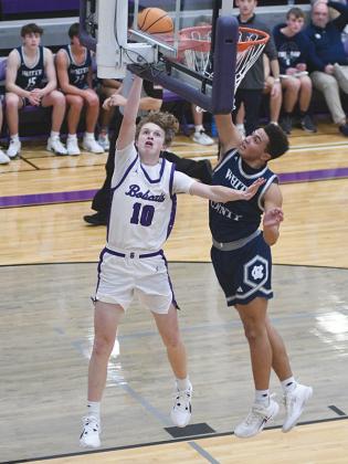 Gilmer’s J.D. Taylor scores two transition points and snatched a steal for another layup in the final seconds of last Friday’s game versus White County. 
