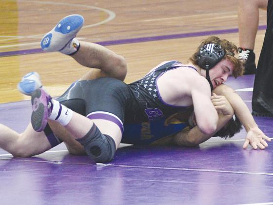 Gilmer High School senior wrestlers Bregan Berry, above, and Alex Raymundo, below. They both won their matches at last weekend’s Class 3A duals state tournament.