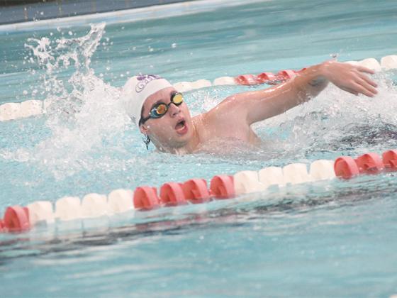 Gilmer’s Conner Defoor, above, and Yana Jones, below, swim the freestyle.