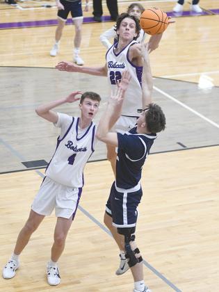 Gilmer’s Jackson McVey (22) blocks a shot versus West Hall Jan. 12 with defensive help from Kohan Davis (4). McVey became the Bobcats’ all-time blocks leader this season and has 147 and counting for his career. 