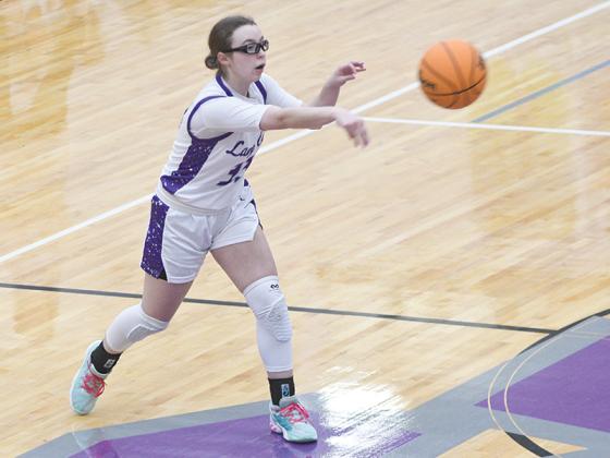 Gilmer senior Sophia Riblet passes along the perimeter and scored six points versus Pickens.