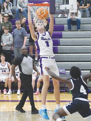 Gilmer senior Ryder Wofford throws down a fast break dunk versus West Hall last Friday.
